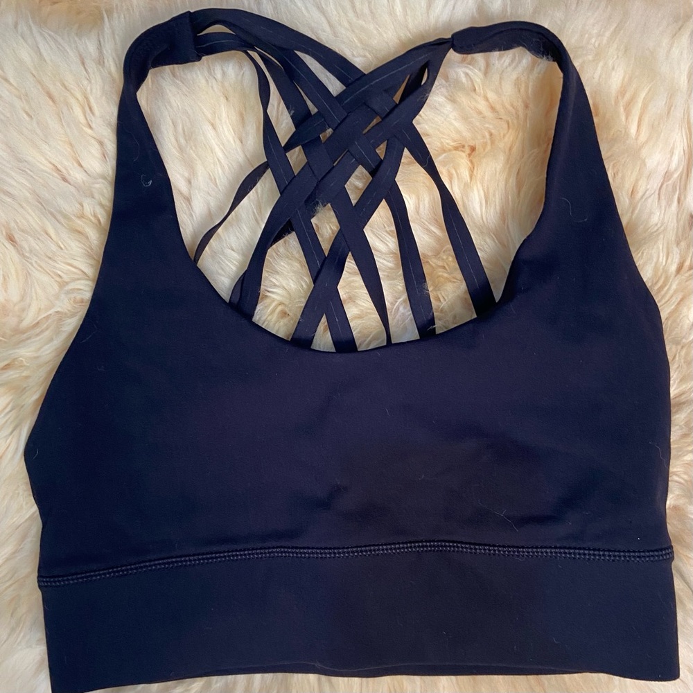 GL women blue knit straps designed back yoga top. Size XS. Used.